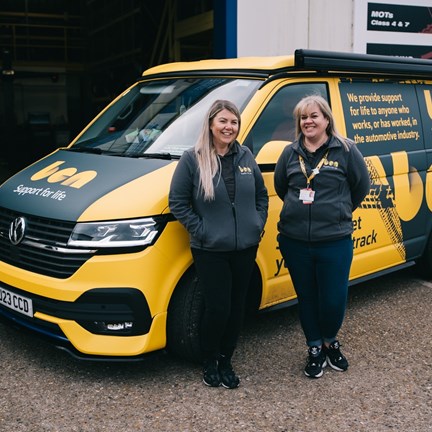 Ben on the road team with bus