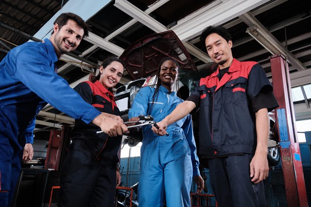 A group of men and women in automotive