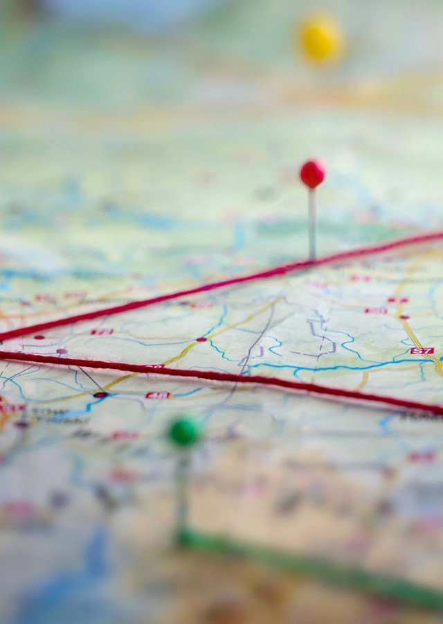 Location marking with a red pins on a map with routes.