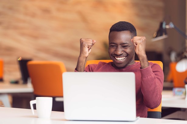 Person on a video call celebrating success