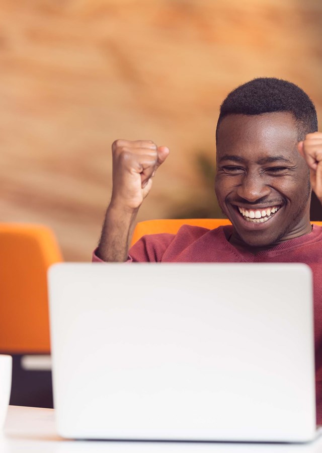 Person on a video call celebrating success