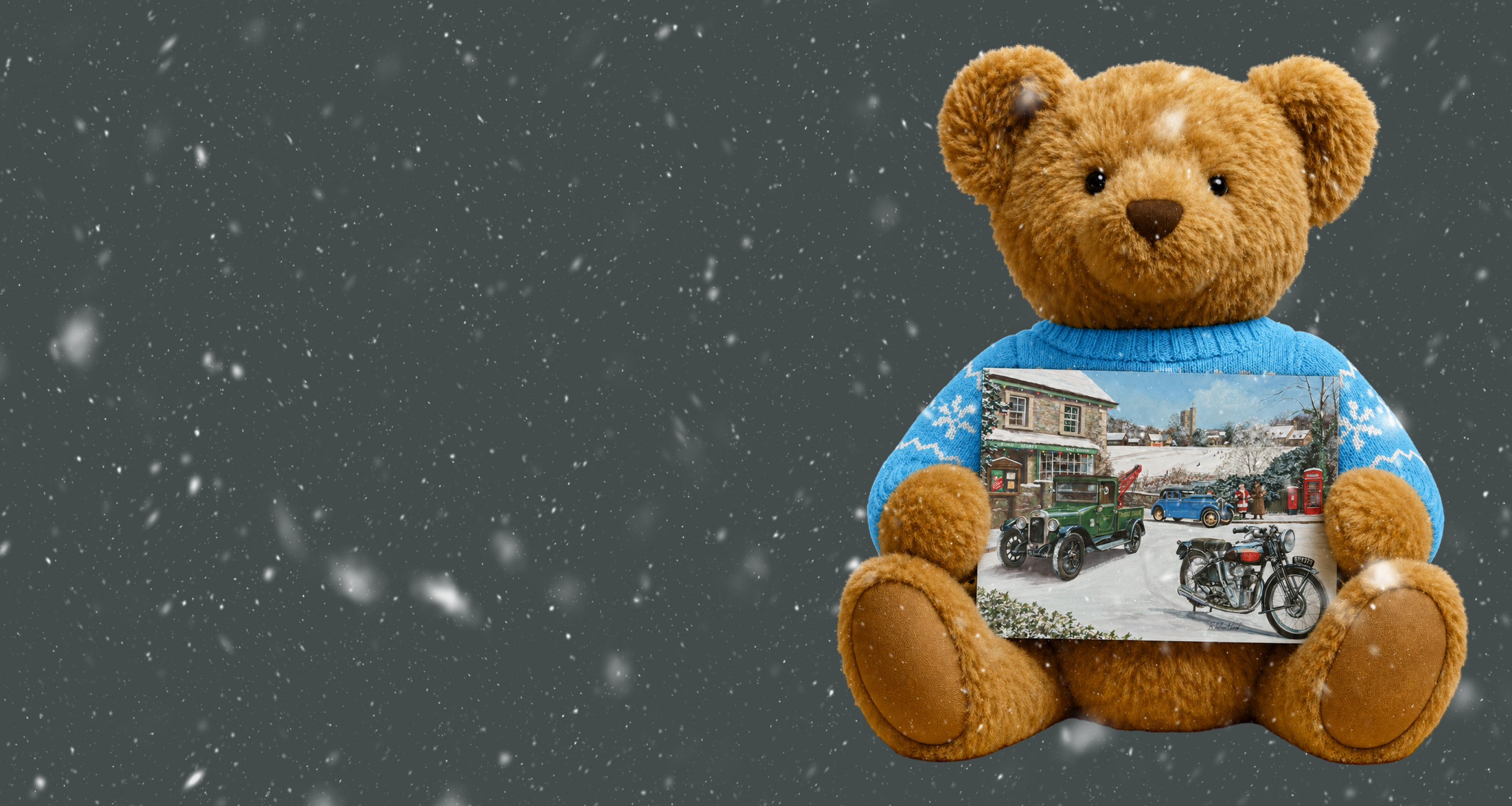 Ben bear with Christmas jumper on, holding a Ben Christmas card