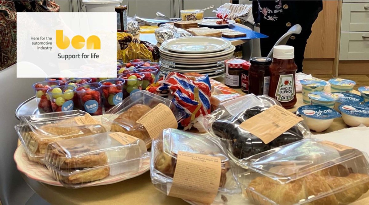 A breakfast spread laid out on a table with pastries, fruit pots in Ben cups, yoghurts, jams and ketchup, with the Ben 'Support for life' logo overlaid.
