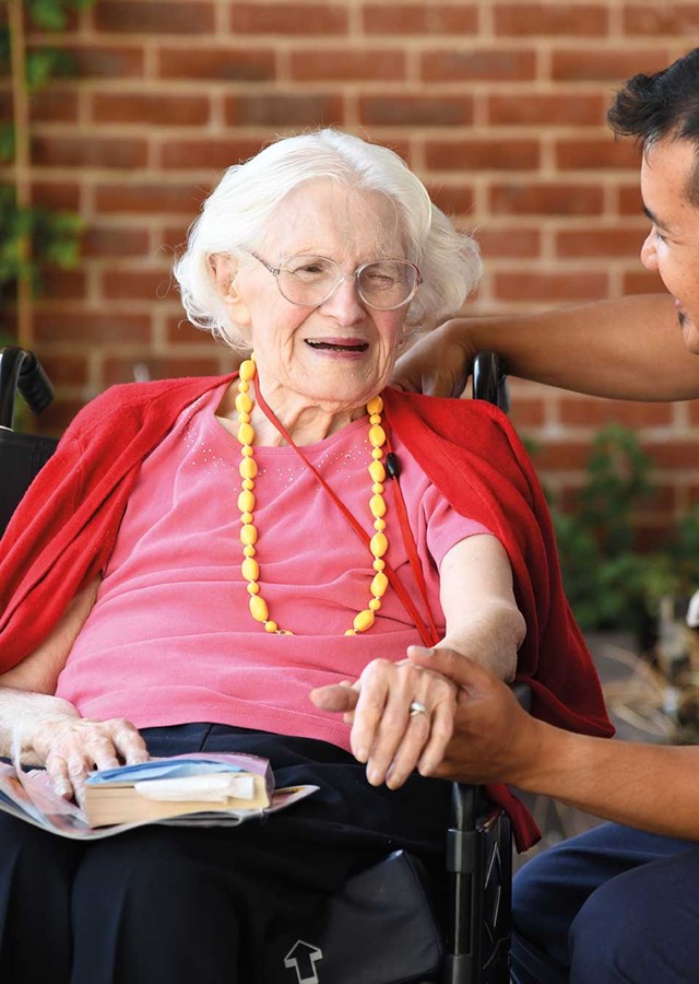 BenCare Image Of Carer and Resident Smiling Outside