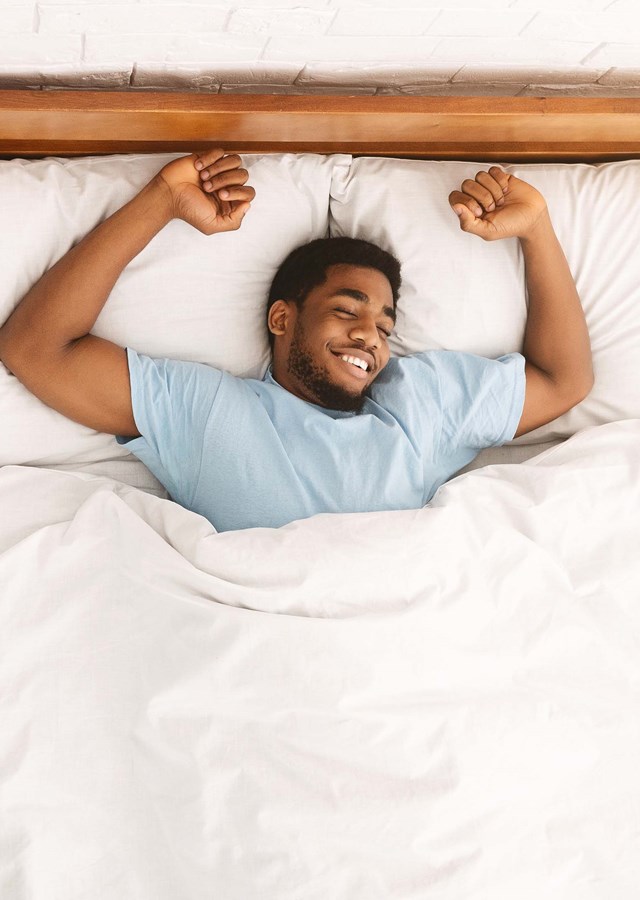 Guide to improving sleep. Man getting some well deserved shut eye after a hard day of work. Tips to getting better sleep. Longer, restful and deep sleep. 