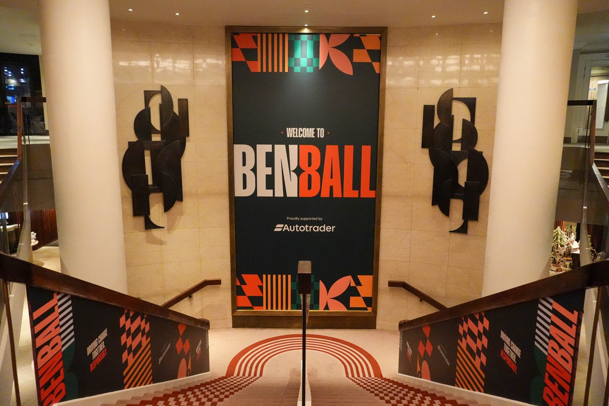 Venue entrance staircase with a large 'Welcome to Ben Ball' banner, proudly supported by Autotrader, and branded stair panels.